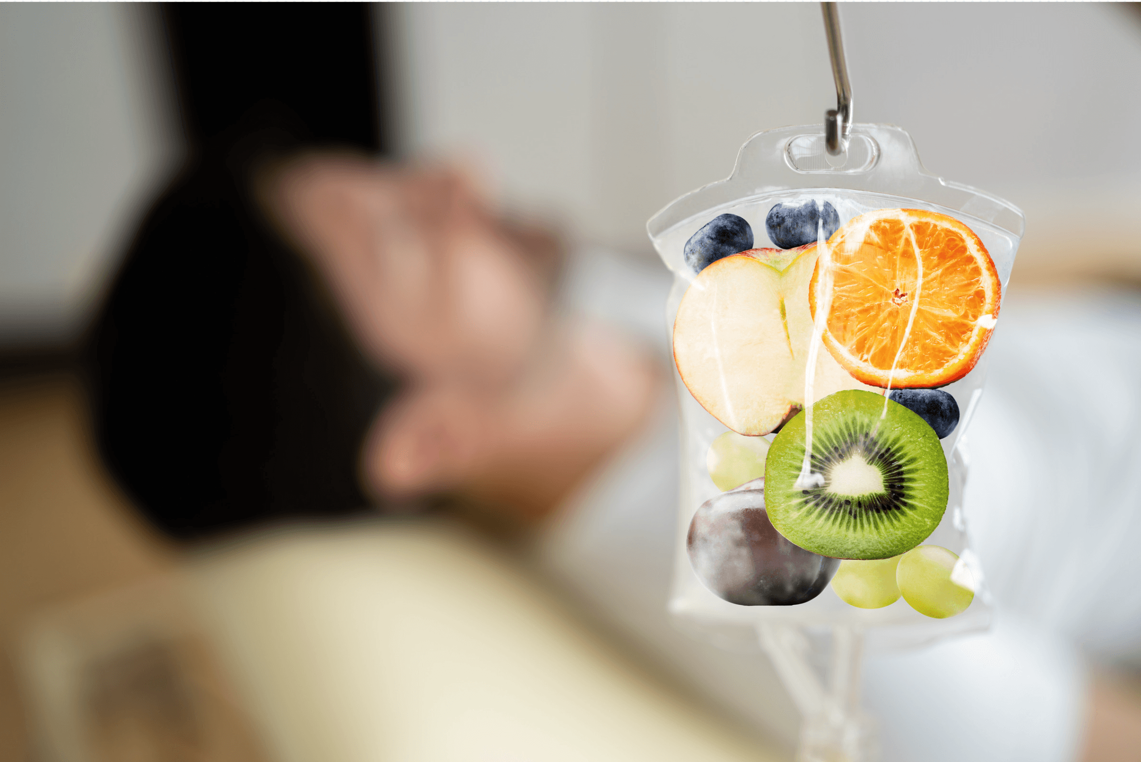 Concept image of an IV drip bag filled with fresh fruit slices, representing vitamin IV therapy